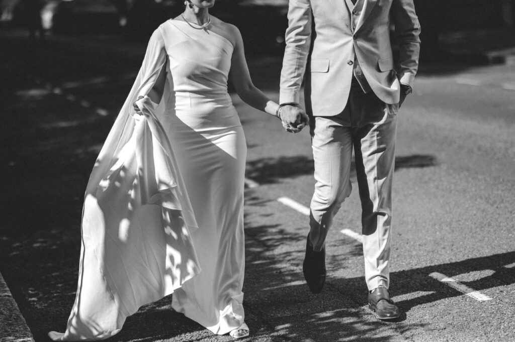 A close-up of Raissa and Vasileios holding hands.