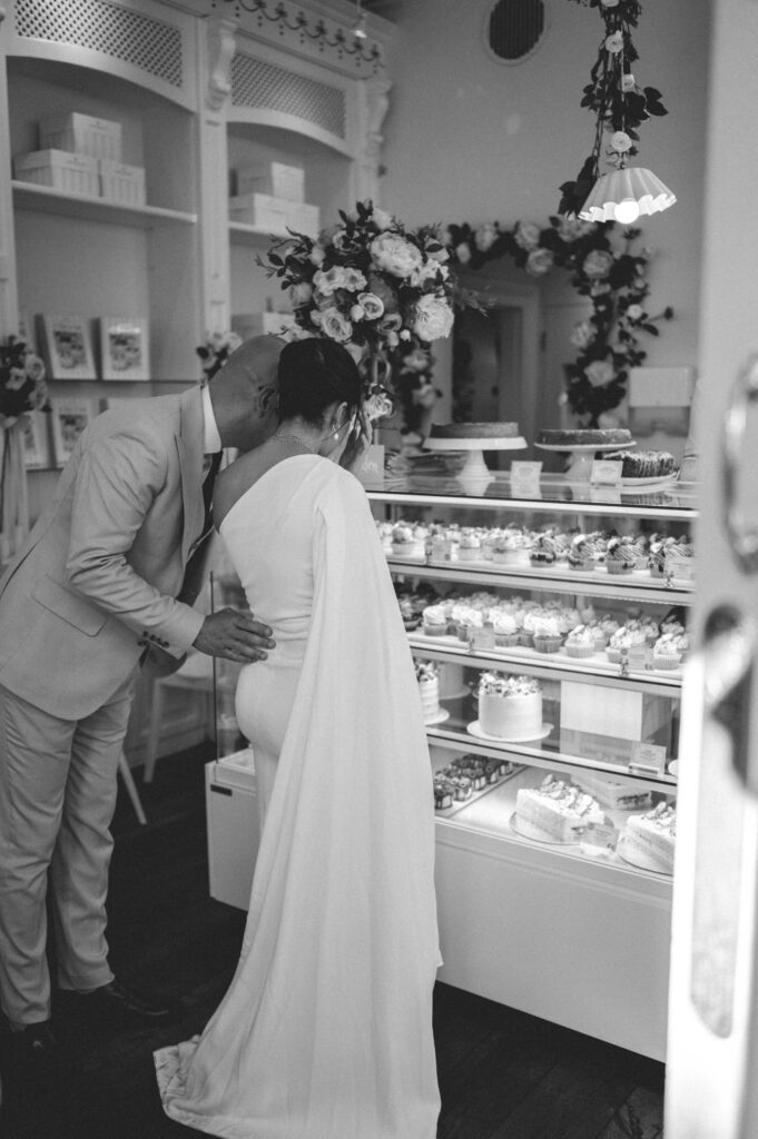 Black and white close-up portrait of Raissa coming out of London black cab.