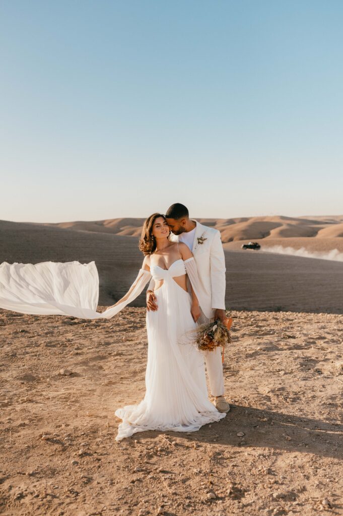 Marrakech elopement wedding photoshoot in Agafey desert with bride and groom.