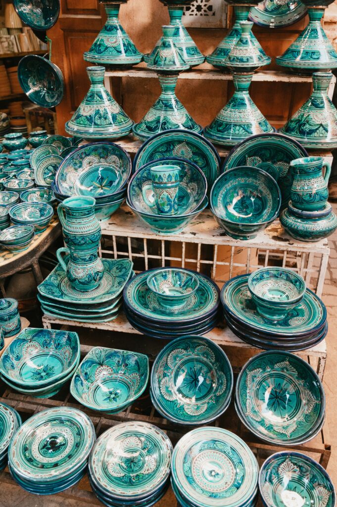 Turquoise hand painted plates and tagines in marrakech medina.
