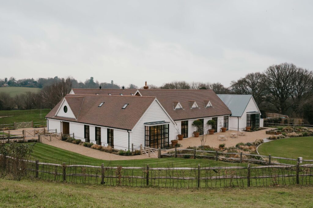 View of Limekiln's 60-acre grounds with rewilded countryside and ancient woodland.